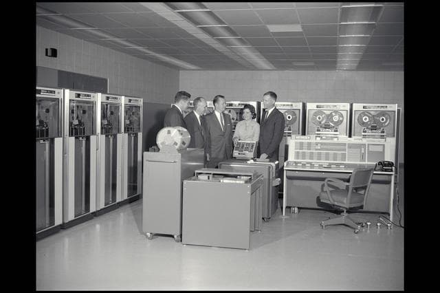 NASA image: Ames and IBM Personnel Discussing the installation of the computing system.