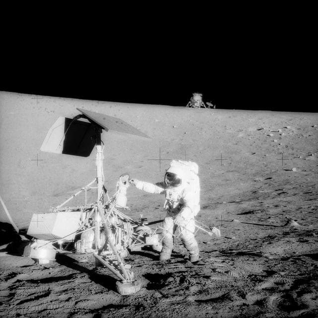 NASA image: Apollo 12 Mission image - Astronaut Alan L. Bean,lunar module pilot,and two U.S. spacecraft 