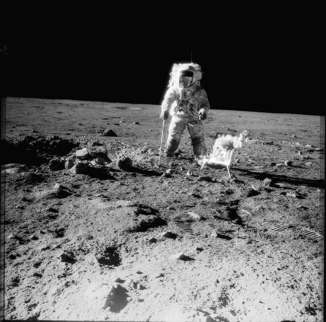 NASA image: Apollo 12 crewman with tools and carrier of Apollo Lunar Hand Tools