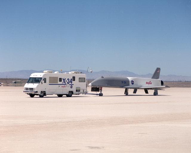 NASA image: X-34 being towed by the Mobile Operations Module during navigational tests on the Rogers Dry Lakebed