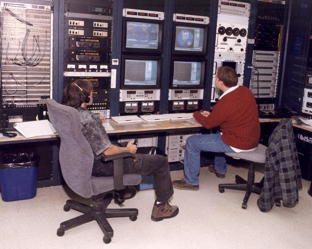 NASA image: Mike Yettaw and Donavon Hoover providing air-to-ground communications to the Johnson Space Center