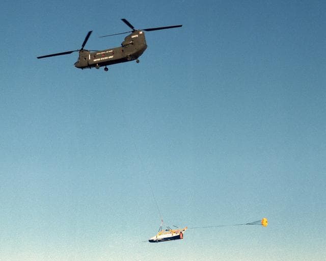 NASA image: The X-40 sub-scale technology demonstrator is suspended under a U.S. Army CH-47 Chinook cargo helicopter during a captive-carry test flight at NASA's Dryden Flight Research Center, Edwards, California.