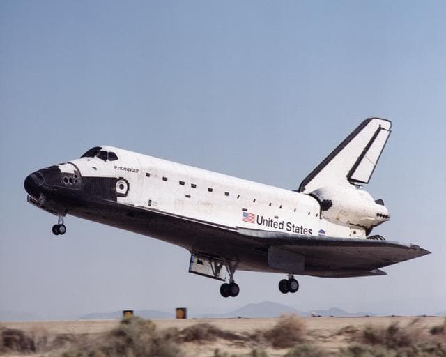 Space Shuttle Endeavour flares for landing at Edwards Air Force Base, California to conclude STS-100