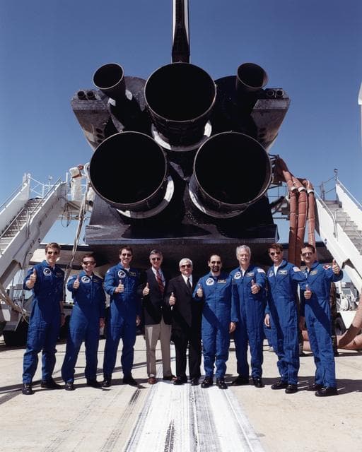 NASA image: A happy "thumbs up" from the crew of the Space Shuttle Endeavour and NASA Dryden Flight Research Center officials heralded the successful completion of mission STS-100