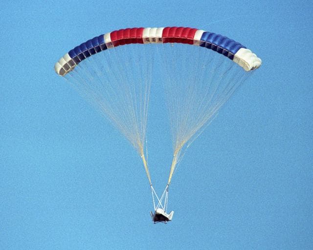 NASA image: The X-38 prototype of the Crew Return Vehicle is suspended under its giant 7,500-square-foot parafoil during its eighth free flight on Thursday, December 13, 2001