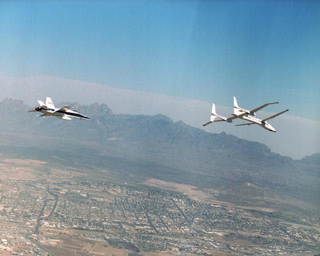 NASA image: Scaled Composites' Proteus and an F/A-18 Hornet from NASA's Dryden Flight Research Center are seen here in flight over Las Cruces, New Mexico.
