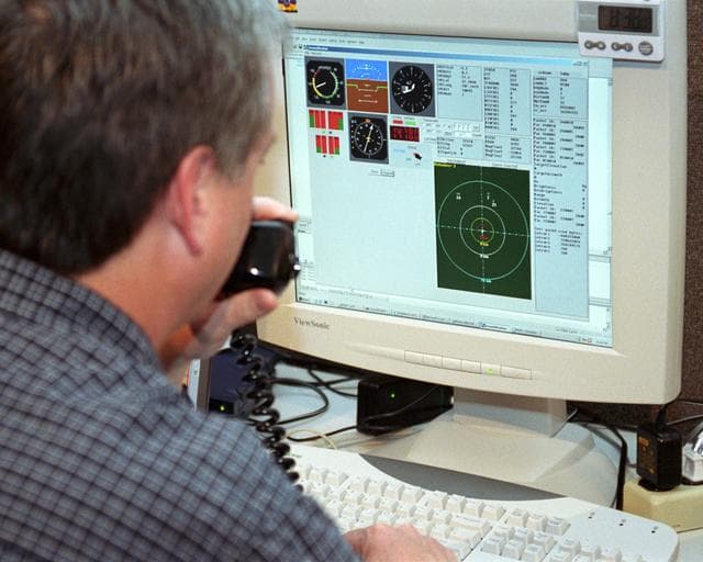 NASA image: Scaled Composites' Doug Shane examines the screen of his ground control station during tests in New Mexico. Shane used this configuration as the ground control station to remotely pilot the Proteus aircraft during a NASA sponsored series of tests.