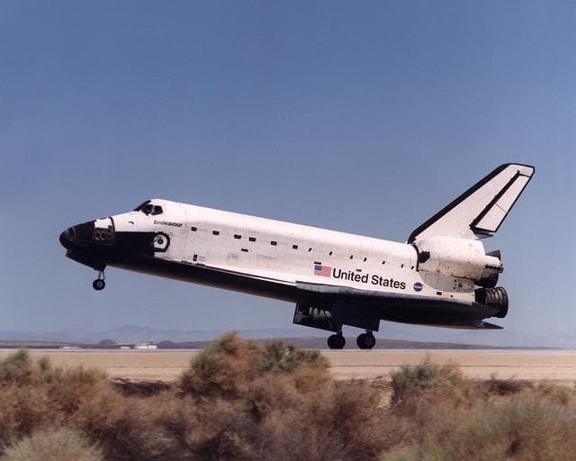 NASA image: Space Shuttle Endeavour touches down on the runway at Edwards Air Force Base, California to conclude International Space Station construction and supply mission STS-111