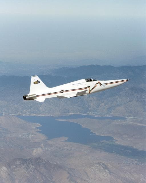 NASA image: Northrop Grumman Corporation's modified U.S. Navy F-5E Shaped Sonic Boom Demonstration (SSBD) aircraft flies over Lake Isabella, Calif., on Aug. 4, 2003