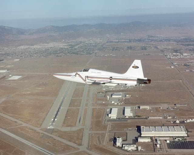 NASA image: Northrop Grumman Corporation's modified U.S. Navy F-5E Shaped Sonic Boom Demonstration (SSBD) aircraft flies over the company's Palmdale, Calif. facilities on Aug. 2, 2003