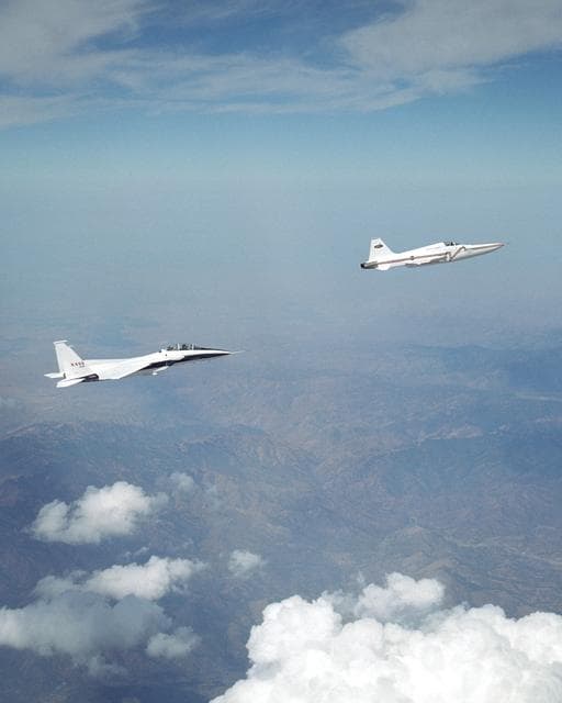 NASA image: NASA's F-15B research testbed jet flew in the supersonic shockwave of a Northrop Grumman Corp. - modified U.S. Navy F-5E jet in support of the Shaped Sonic Boom Demonstration project.