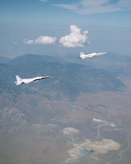 NASA image: NASA's F-15B research testbed jet flew in the supersonic shockwave of a Northrop Grumman Corp. - modified U.S. Navy F-5E jet in support of the Shaped Sonic Boom Demonstration project.