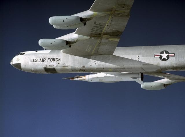 NASA image: NASA's B-52 mother ship carries the X-43A and its booster rocket on a captive carry flight Jan. 26, 2004