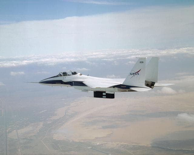 NASA image: All six divots of thermal insulation foam have been ejected from the flight test fixture on NASA's F-15B testbed as it returns from a LIFT experiment flight.