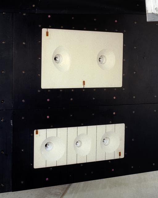 NASA image: A close-up of the panels on the F-15B's flight test fixture shows five divots of TPS foam were successfully ejected during the LIFT experiment.