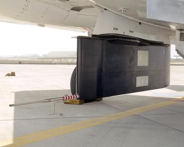 NASA image: A post-flight inspection of the panels on the F-15B's flight test fixture shows five divots of TPS foam were successfully ejected during the LIFT experiment.