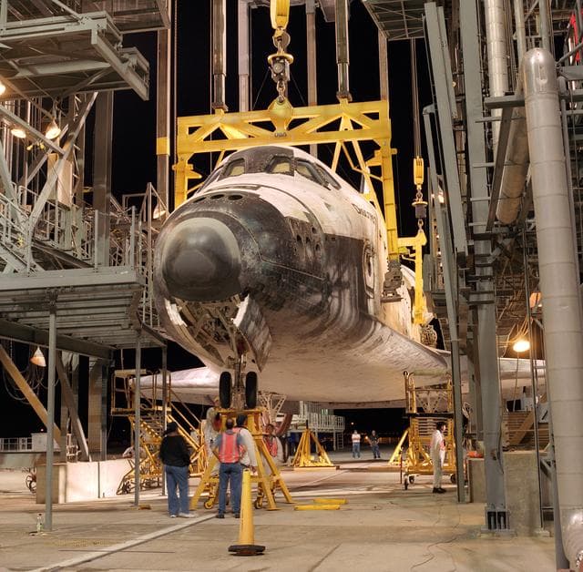 NASA image: The Space Shuttle Discovery receives post-flight servicing in the Mate-Demate Device (MDD) at NASA's Dryden Flight Research Center, Edwards, California