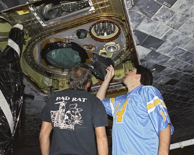 NASA image: Technicians inspect external tank attachment fittings on the Space Shuttle Discovery as part of its post-flight processing at NASA DFRC