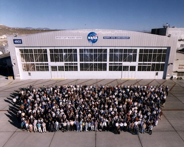 NASA image: Complete NASA Dryden Staff of 1996 for 50th anniversary, on back ramp of building 4800