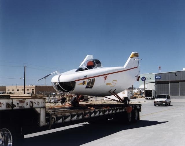 NASA image: M2-F1 lifting body aircraft on a flatbed truck