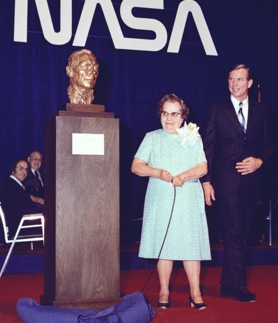 NASA image: Mrs. Hugh Dryden unveils the memorial to her late husband at center dedication, with center director David Scott