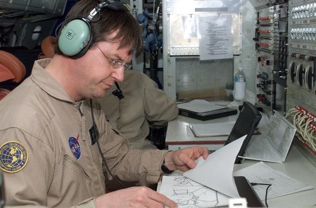 NASA image: David Bushman at the Mission Manager's console onboard NASA's DC-8 during the AirSAR 2004 campaign