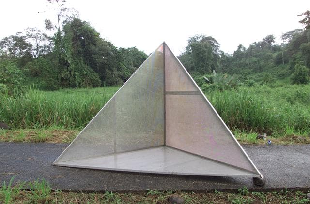 NASA image: Reflectors used to calibrate the DC-8's AirSAR seen here setup in the Costa Rican rain forest by scientist Paul Siqueira from NASA’s Jet Propulsion Lab
