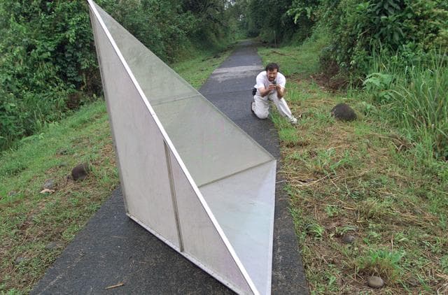 NASA image: Reflectors used to calibrate the DC-8's AirSAR seen here setup in the Costa Rican rain forest by scientist Paul Siqueira from NASA’s Jet Propulsion Lab