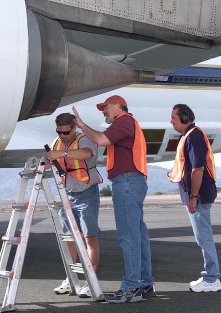 NASA image: NASA Dryden DC-8 maintenance crew members inspect the aircraft prior to take-off for an AirSAR 2004 flight