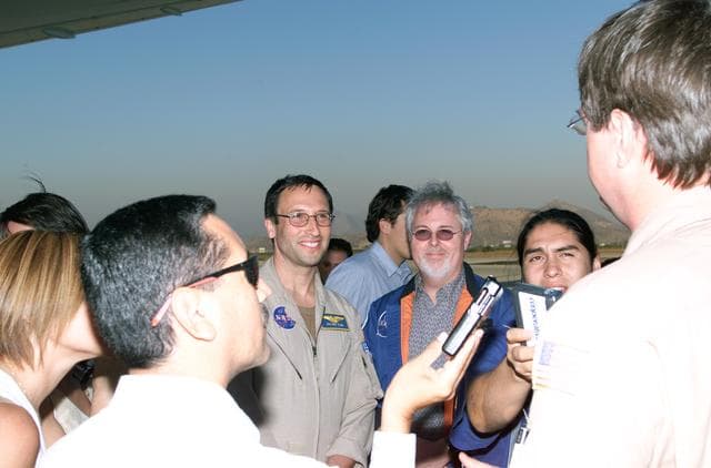 NASA image: L to R; Walter Klein (in tan flight suit), Tim Miller, and David Bushman briefing press in Santiago, Chile, for NASA's AirSAR 2004 mission