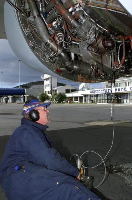 NASA image: NASA DC-8 Ground Support Technician Joe Niquette performs routine maintenance on the DC-8 aircraft in Punta Arenas, Chile
