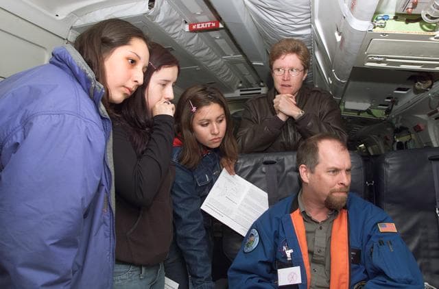 NASA image: JPL scientist Dr. David Imel and U.S. Air Force Colonel Gwen Linde lead Chilean students on a tour of the DC-8 aircraft in Punta Arenas, Chile