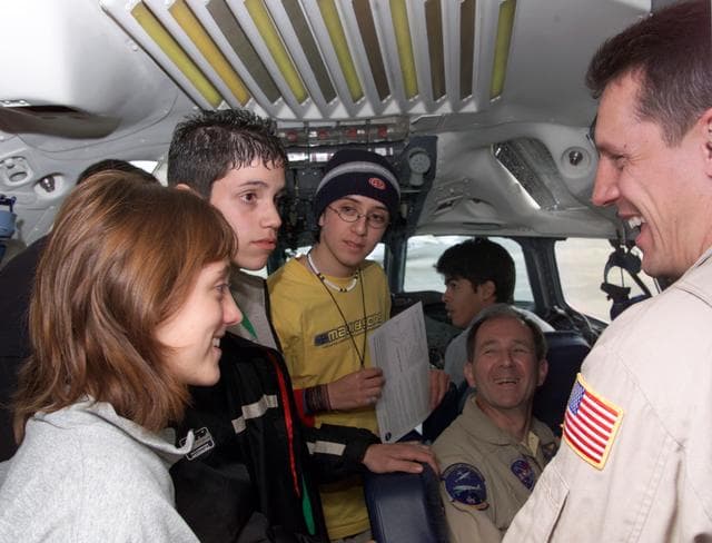 NASA image: NASA DC-8 Pilots Craig Bomben and Bill Brockett explain the DC-8 cockpit to Chilean students onboard the DC-8 aircraft in Punta Arenas, Chile