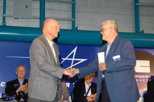 NASA image: Research pilot and former astronaut Gordon Fullerton is congratulated by retired astronaut Fred Haise upon Fullerton's induction into the Astronaut Hall of Fame