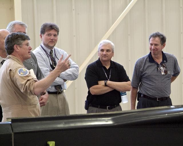 NASA image: Jim Smolka (left) details a flight experiment to Jerry McKee, Kevin Petersen and NASA Administrator Mike Griffin (right) during Griffin's initial visit to DFRC