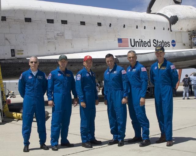 NASA image: The crew of Space Shuttle mission STS-117 gathered in front of the shuttle Atlantis following landing at Edwards Air Force Base, California, June 22, 2007