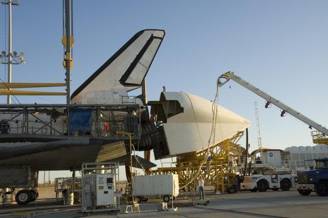 NASA image: Technicians attach the tail cone to the Space Shuttle Atlantis in preparation for its return to NASA's Kennedy Space Center in Florida