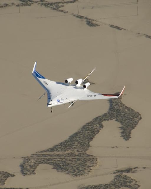 NASA image: Boeing's sub-scale X-48B Blended Wing Body aircraft flies over the edge of Rogers Dry Lake at Edwards Air Force Base during its fifth flight on Aug. 14, 2007
