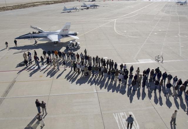 NASA image: More than 200 Dryden staff formed two long lines on the Dryden ramp to greet retired research pilot Gordon Fullerton after his final flight in a NASA F/A-18.