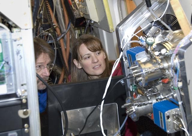 NASA image: Chris Cantrell and Becky Anderson of the National Center for Atmospheric Research assess the CIMS instrument's operation during ARCTAS mission preparations
