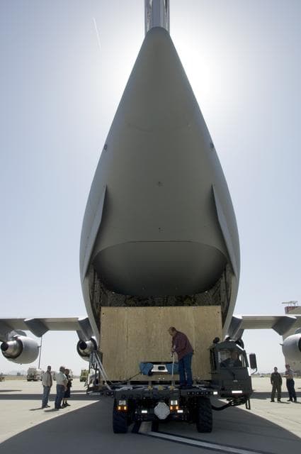 NASA image: Ground crewmen prepare to load the crated SOFIA primary mirror assembly into an Air Force C-17 for shipment to NASA Ames Research Center for finish coating
