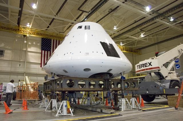 NASA image: The boilerplate Orion crew module for the Orion Launch Abort System Pad Abort-1 flight test undergoes moment-of-inertia testing at Dryden's Flight Loads Lab.