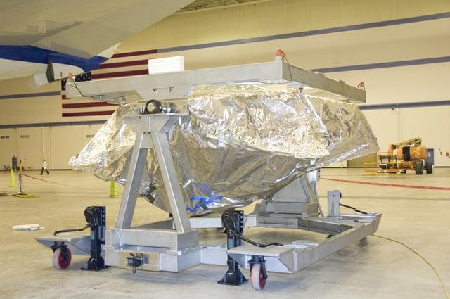 NASA image: SOFIA's primary mirror assembly rests in its transportation cradle prior to reinstallation in NASA's airborne laboratory on Oct. 8, 2008