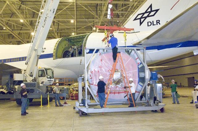 NASA image: Engineers and technicians prepare SOFIA's German-built primary mirror assembly for reinstallation into NASA's 747SP airborne observatory