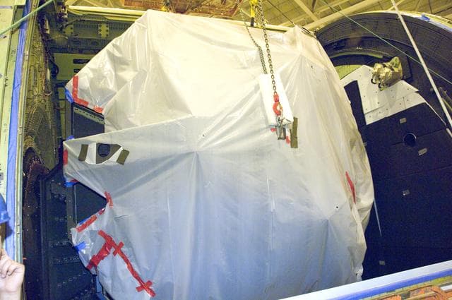 NASA image: SOFIA's primary mirror is placed in the telescope cavity for reinstallation prior to telescope adjustments preparing SOFIA for first science
