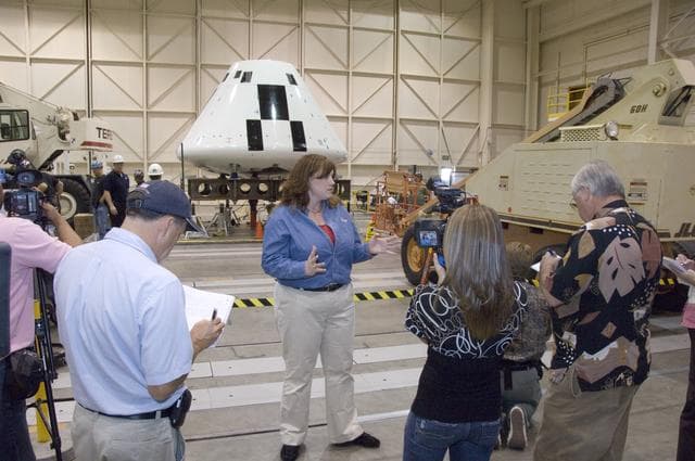 NASA image: Cathy Bahm, Orion Abort Flight Test integration deputy project manager, briefs news media on the progress of testing in NASA Dryden's Flight Loads Laboratory.