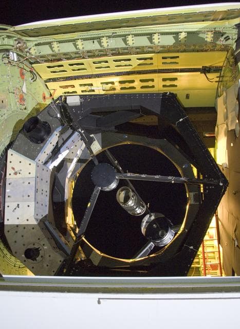 NASA image: he SOFIA airborne observatory's 2.5-meter infrared telescope peers out from its cavity in the SOFIA rear fuselage during nighttime line operations testing