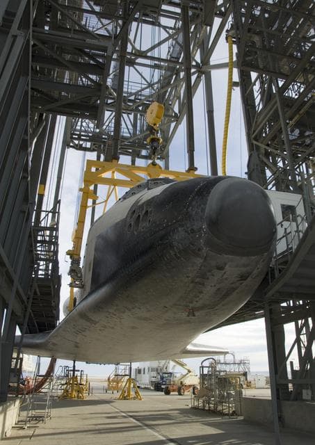 NASA image: Endeavour is slowly hoisted aloft in the Mate-Demate gantry before being mounted atop its modified 747 carrier aircraft for a ferry flight back to Florida