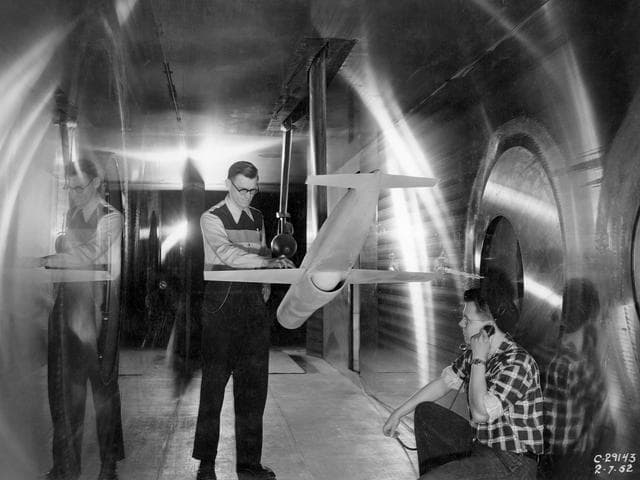 NASA image: Ramjet Model and Technicians in the 8- by 6-Foot Supersonic Wind Tunnel