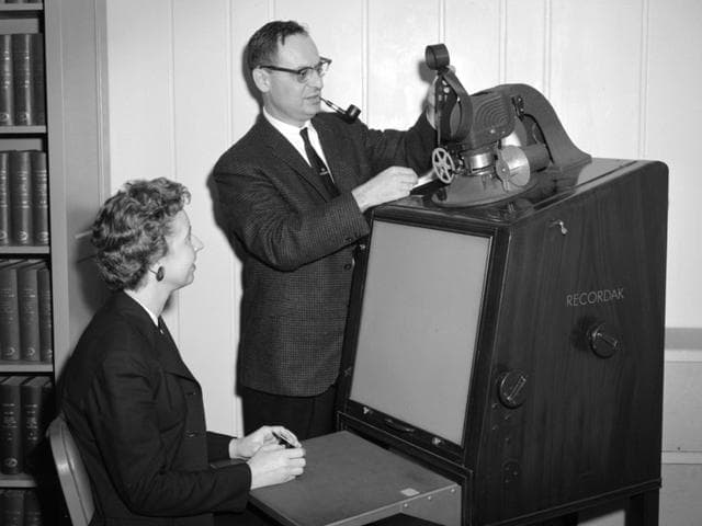 NASA image: Library Staff operate a Microfilm Reader at the Lewis Research Center